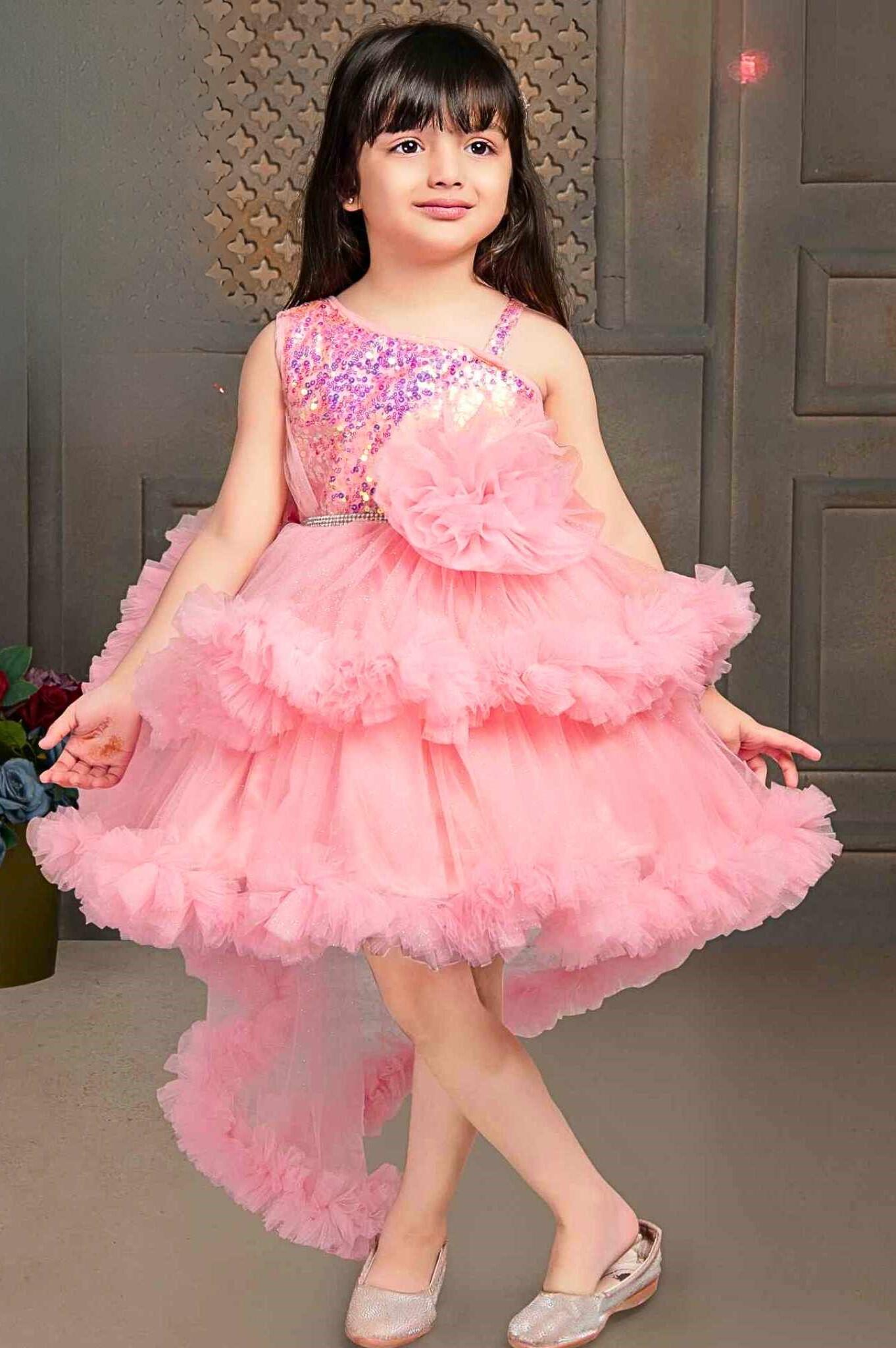Peach Shimmer Tailback Party Wear Frock With Ruffle Layers For Girls