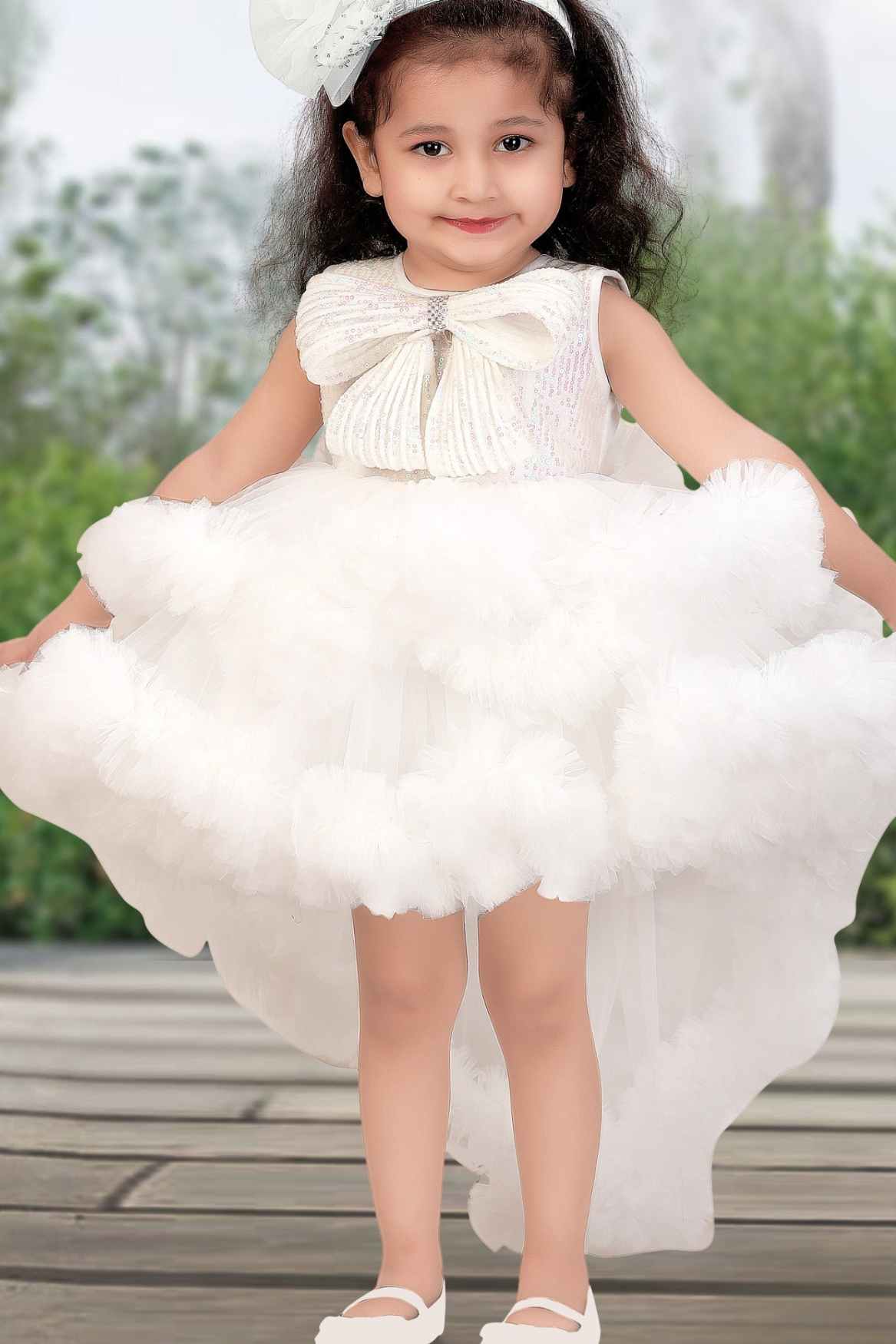 White Ruffle Party Tailback Frock With Sequin Work Oversized Bow For Girls