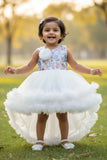 White Party Frock with Floral Bodice and Ruffled Hemline And Tailback For Girls