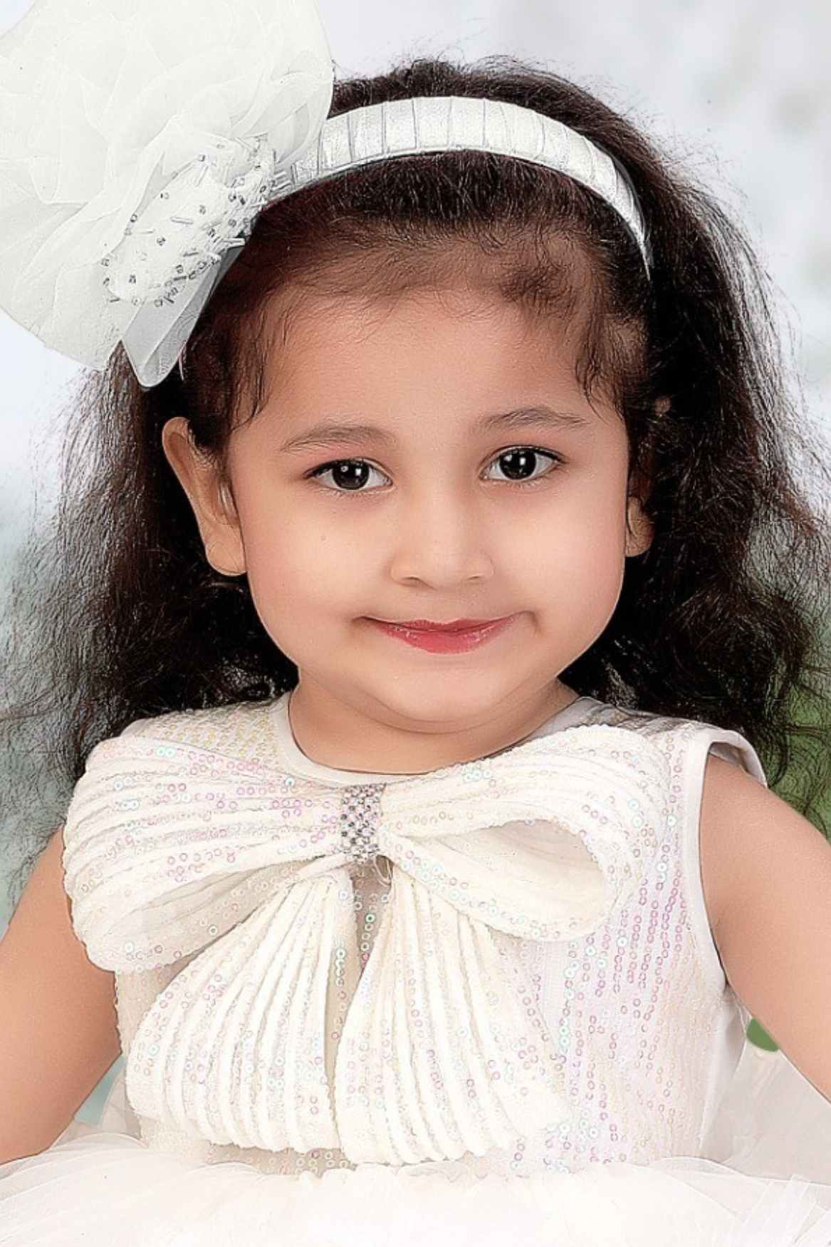 White Ruffle Party Tailback Frock With Sequin Work Oversized Bow For Girls