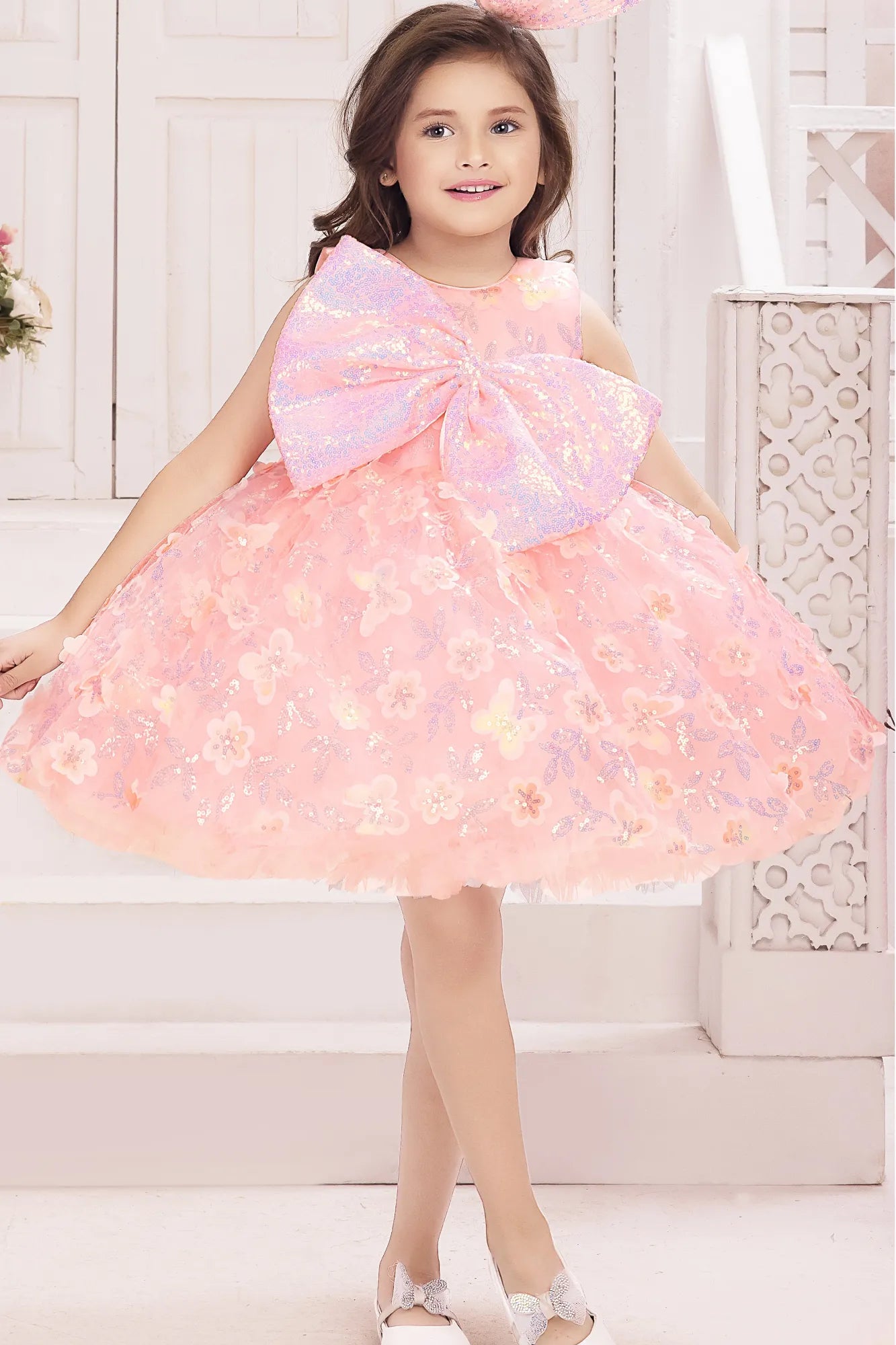Peach Sequin Bow Party Wear Frock With 3D Floral Embellishments For Girls
