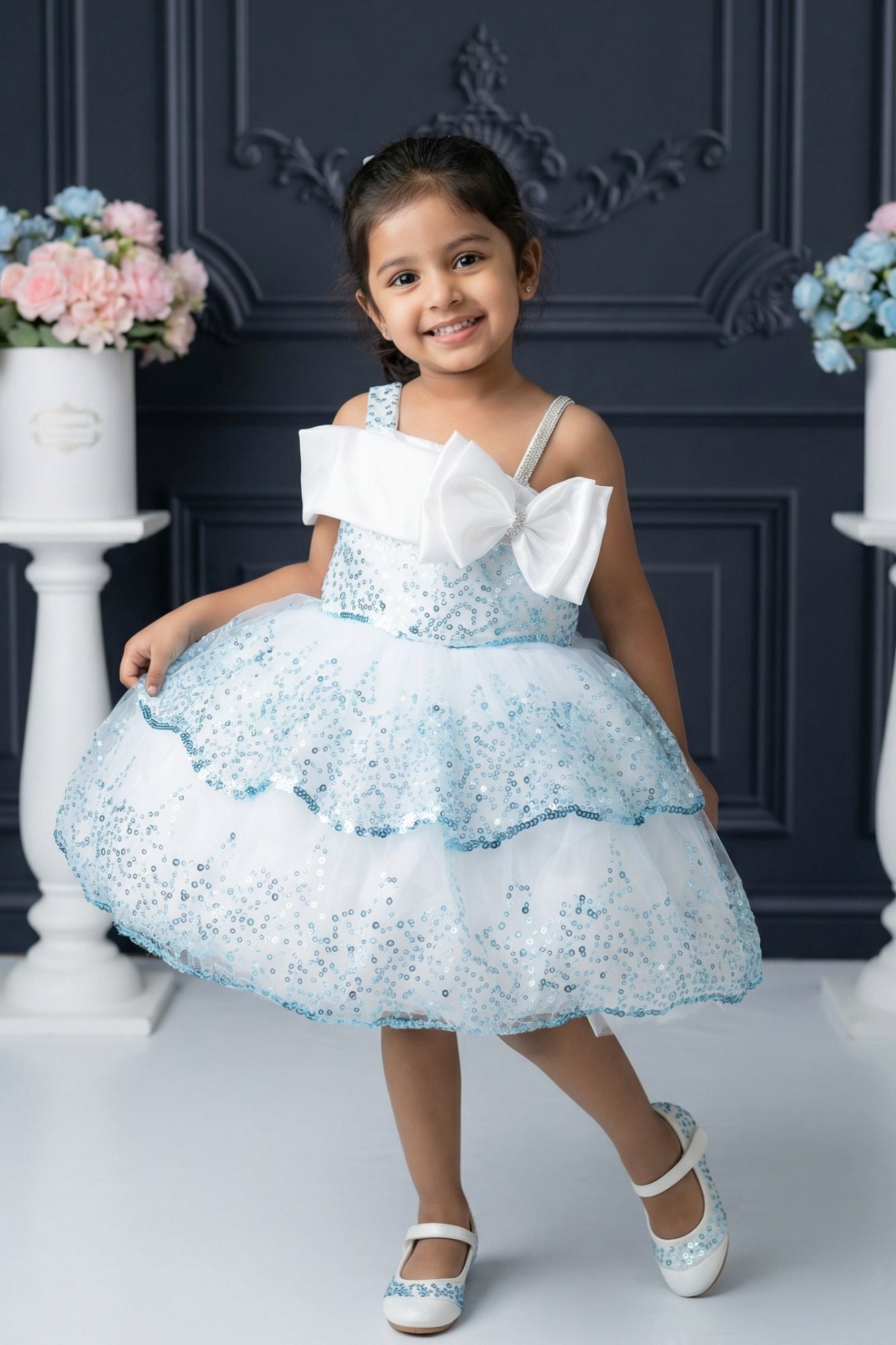 Ice Blue Sequin Layered Ruffle Party Wear Frock With Statement Bow For Girls