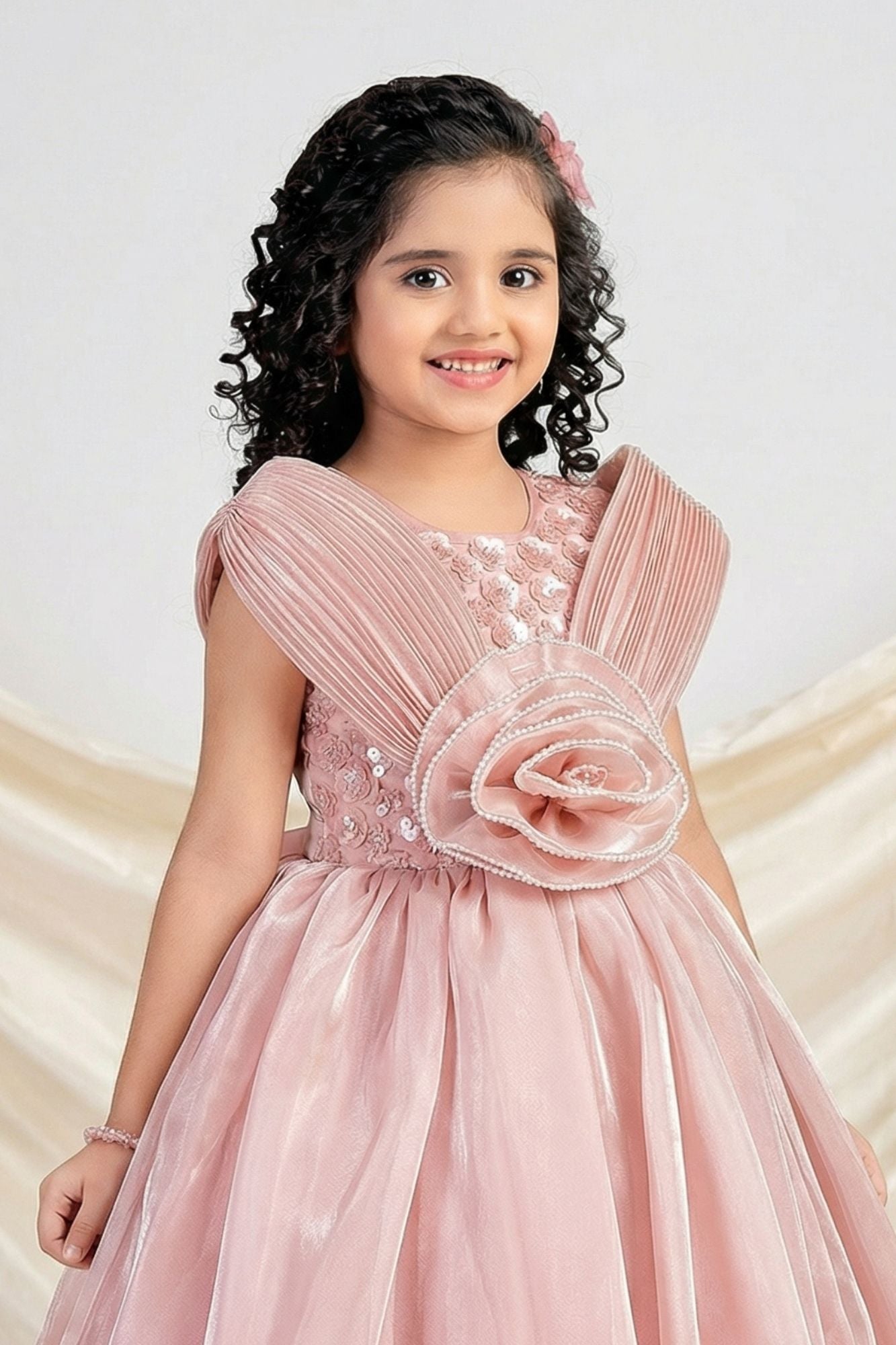 Designer Peach Embellished Rosette Party Gown For Girls