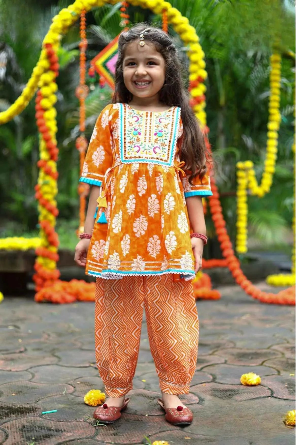 Orange Printed Kurta Dhoti Set with Embroidered Yoke and Tassel Tie-Ups For Girls