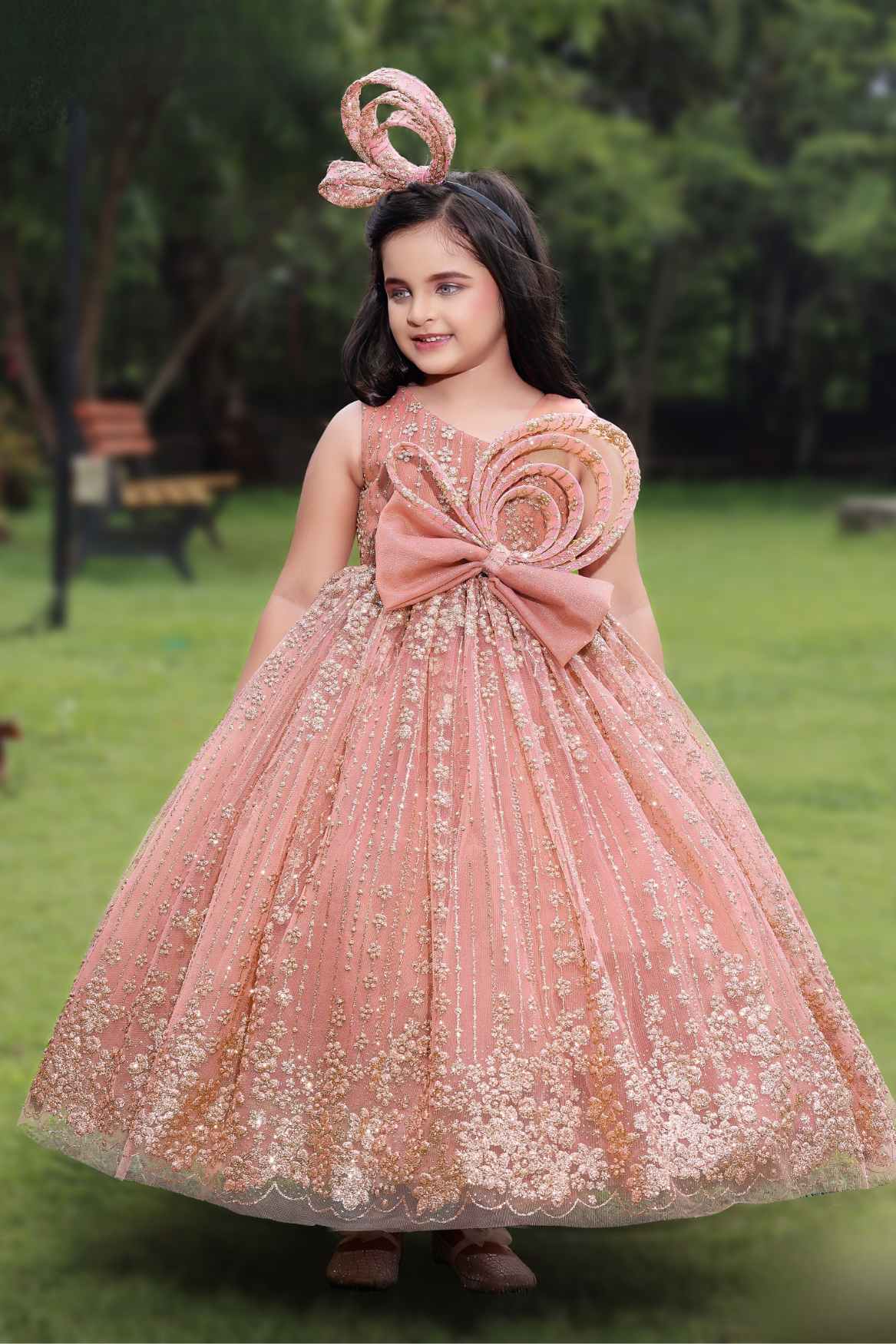 Peach Gown With Bow Embellished And Shimmer Printed For Girls