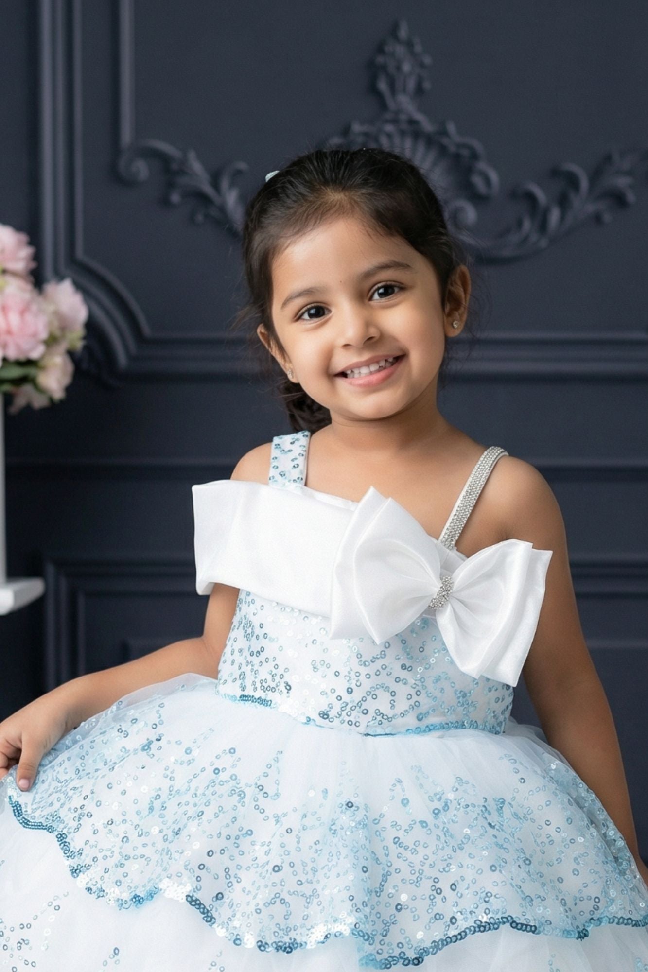 Ice Blue Sequin Layered Ruffle Party Wear Frock With Statement Bow For Girls