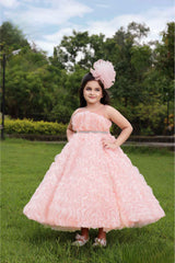 Peach Gown With Ruffled And Stone Waist Band For Girls