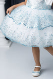 Ice Blue Sequin Layered Ruffle Party Wear Frock With Statement Bow For Girls