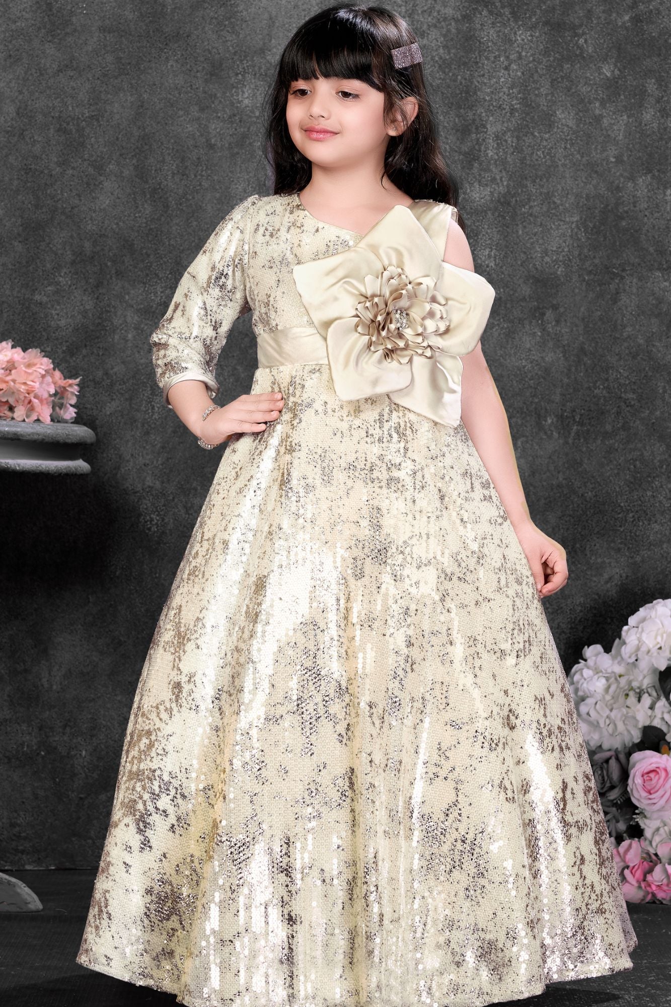 Fawn Sequin Party Wear Gown With One-Shoulder Sleeve And Statement Floral Bow For Girls