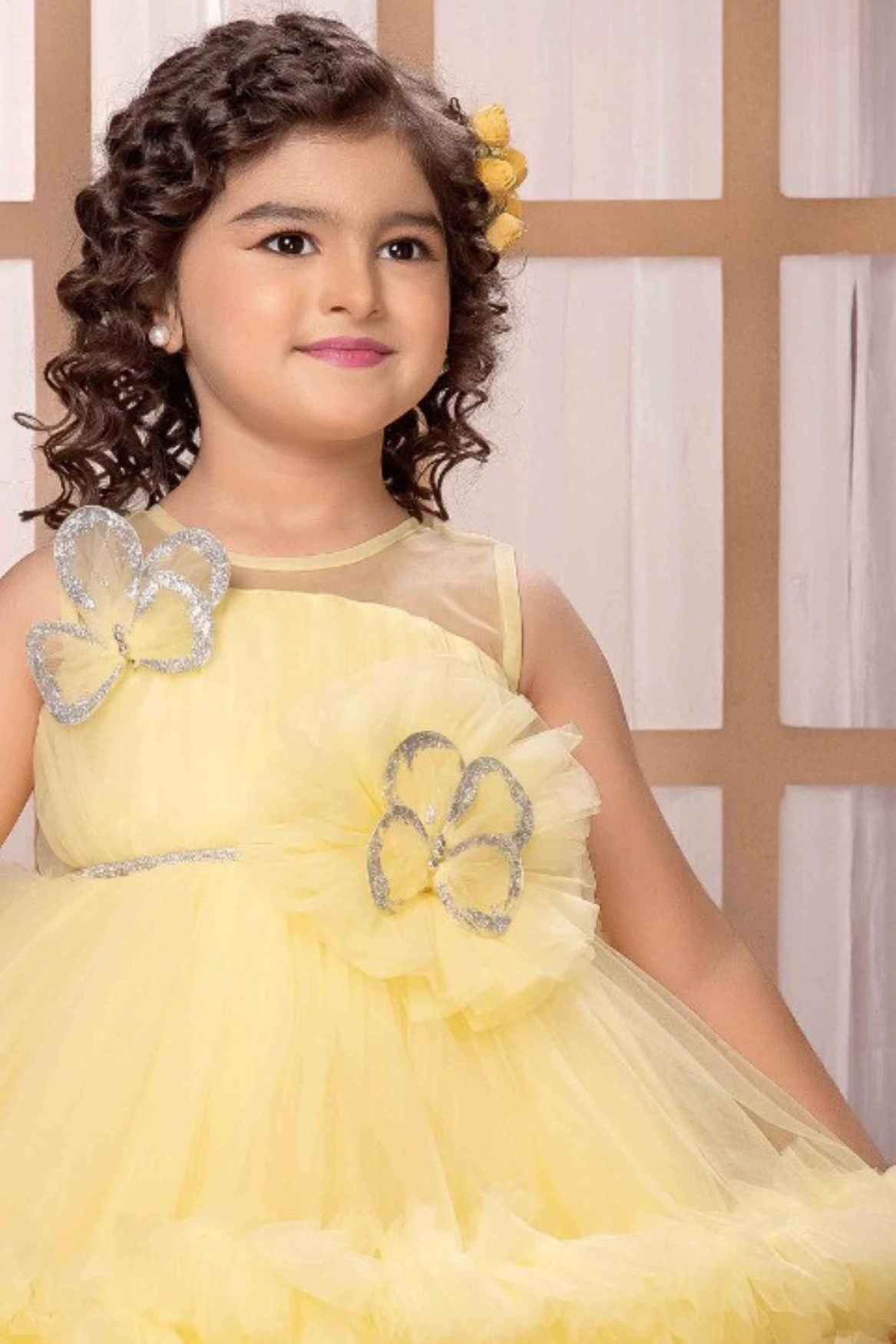 Lemon Yellow Sleeveless And Butterfly Embellished Tailback Frock For Girls