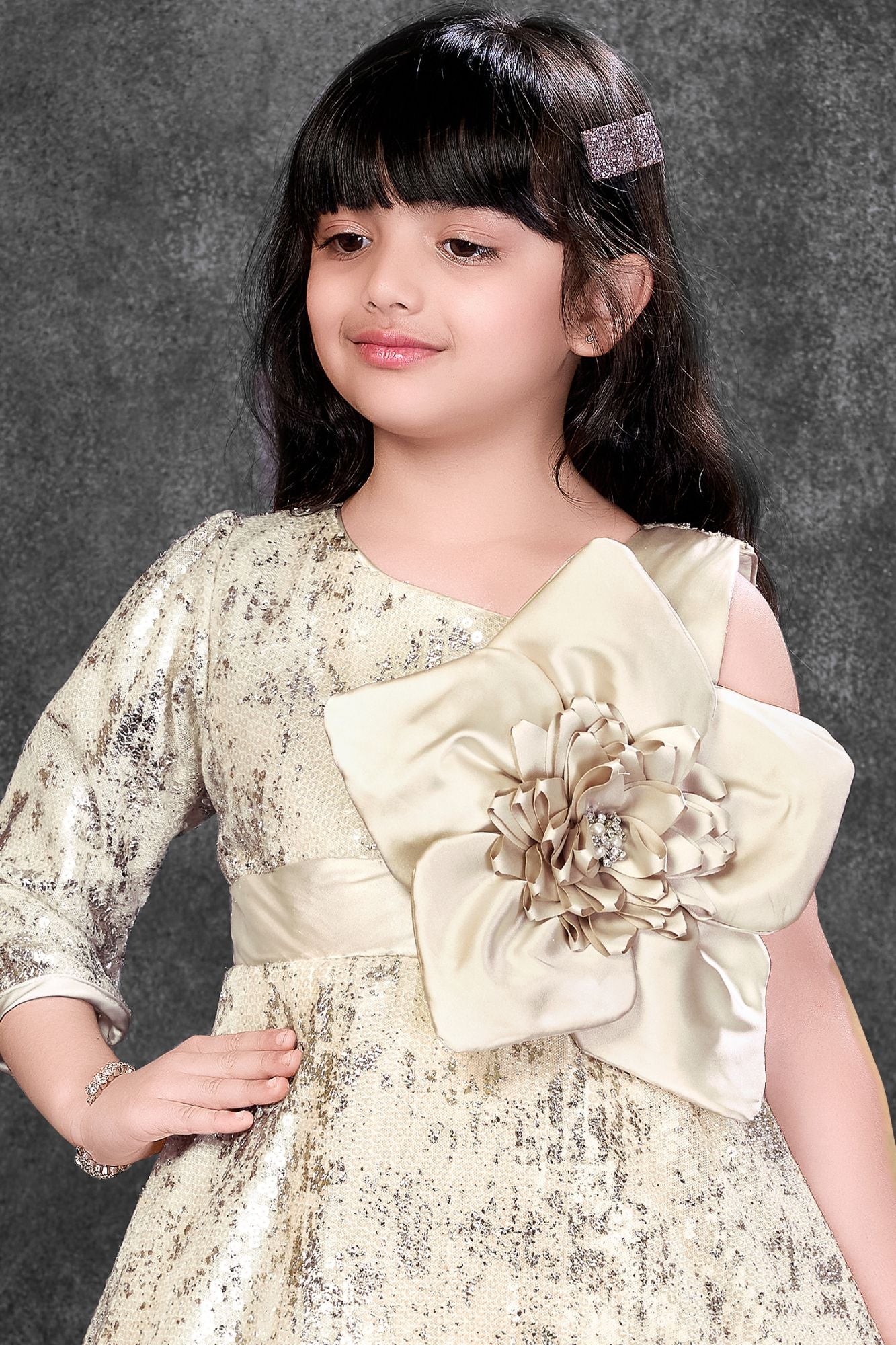 Fawn Sequin Party Wear Gown With One-Shoulder Sleeve And Statement Floral Bow For Girls