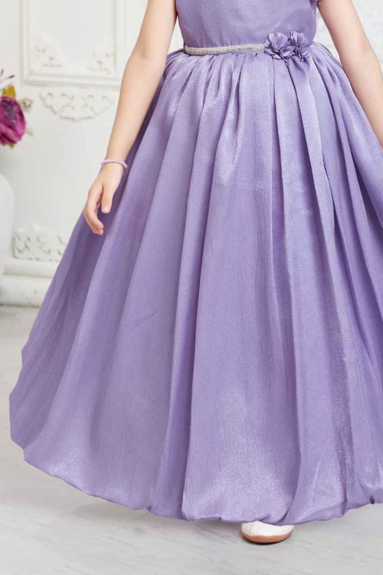 Purple Gown With Floral Embellished And Stone Waist Band For Girls