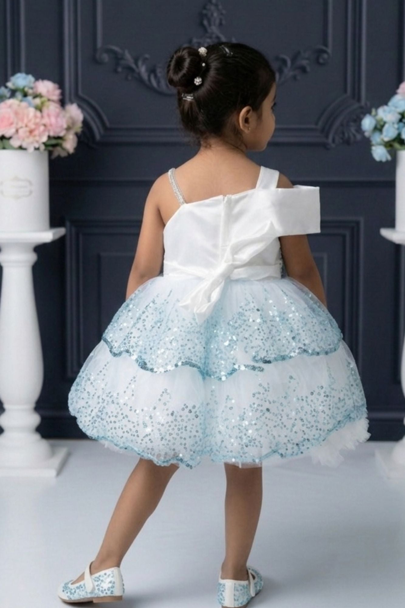 Ice Blue Sequin Layered Ruffle Party Wear Frock With Statement Bow For Girls