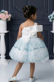 Ice Blue Sequin Layered Ruffle Party Wear Frock With Statement Bow For Girls