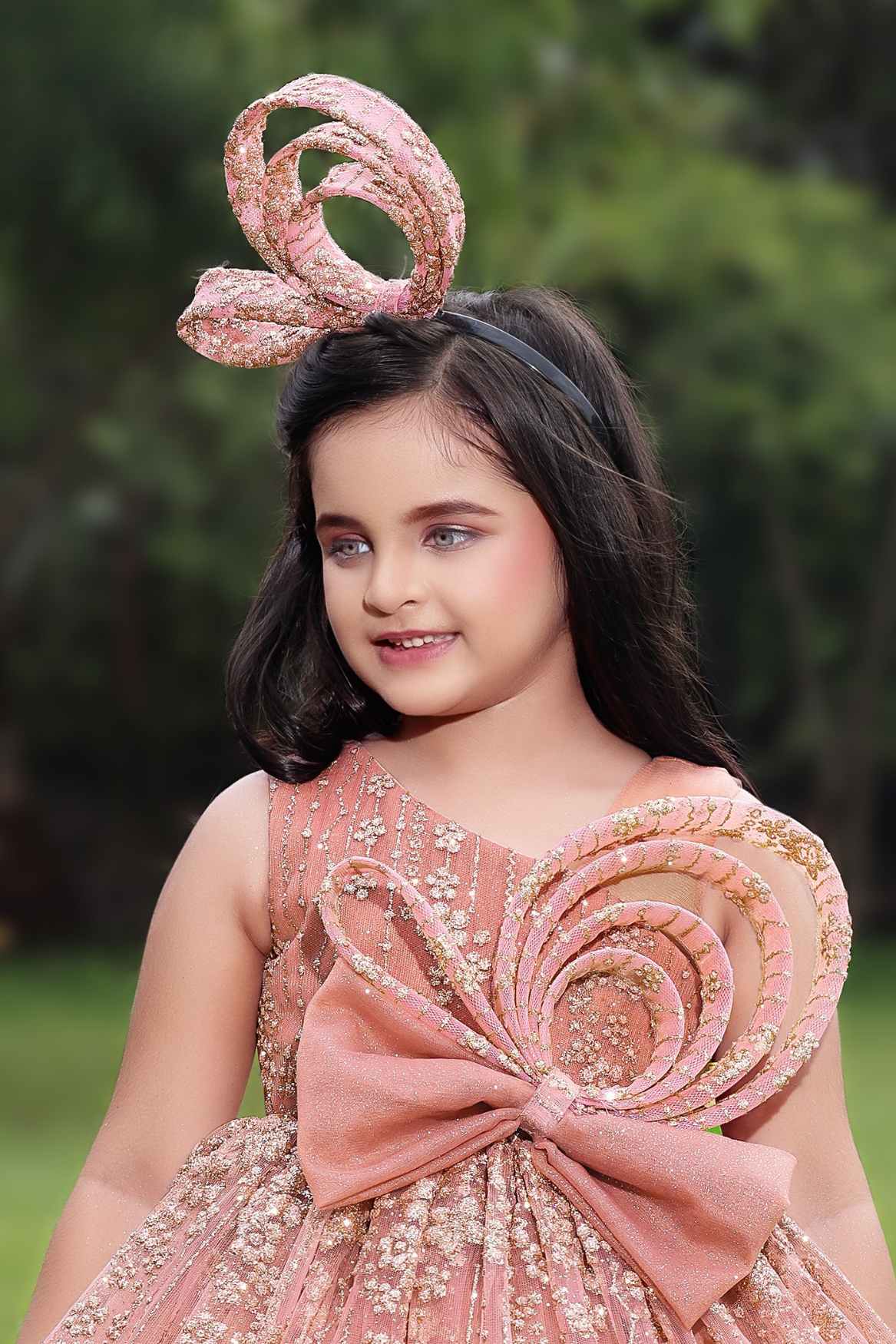 Peach Gown With Bow Embellished And Shimmer Printed For Girls