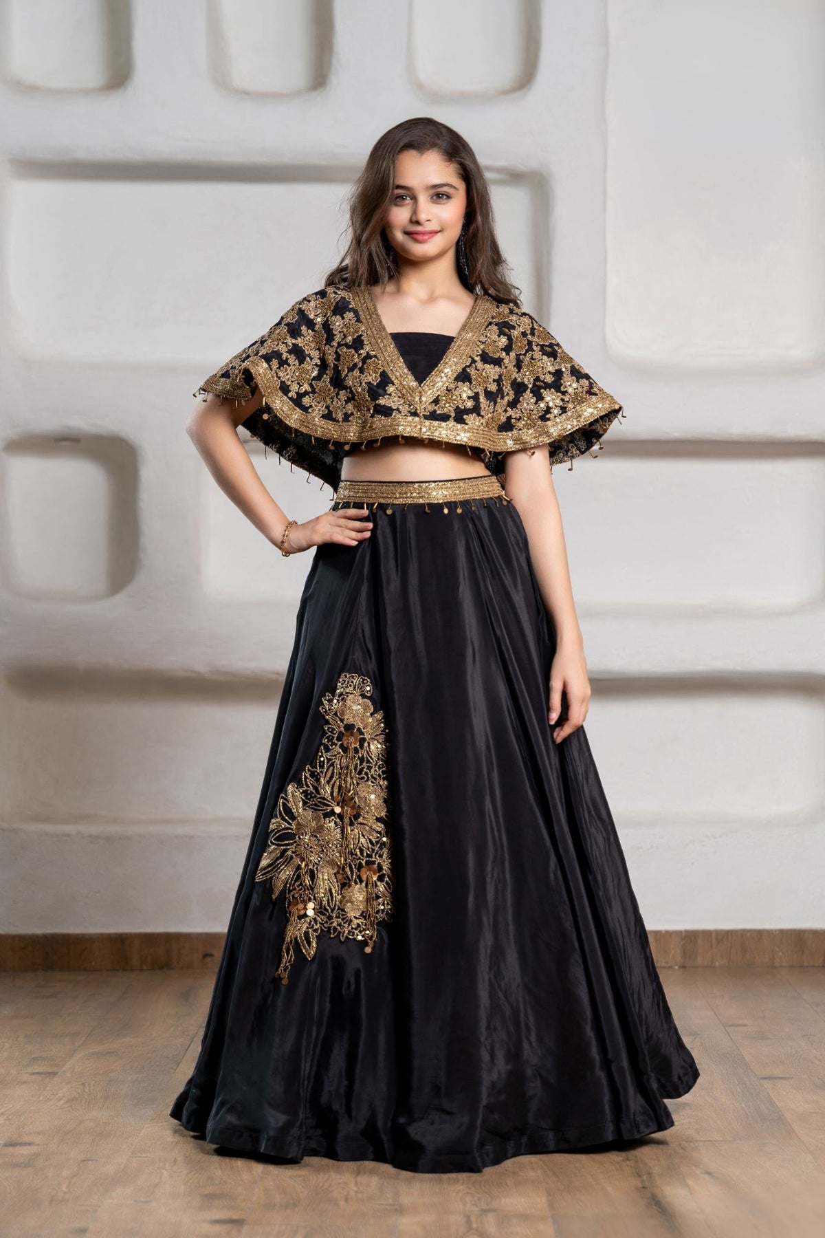 Girls Black And Gold Embroidered Cape Lehenga Choli