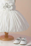 White Party Frock with Oversized Floral Appliqué and Pleated Shine Finish For Girls