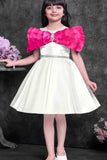 Off-White Party Wear Frock with Pink Bow Appliqué And Flared Skirt For Girls