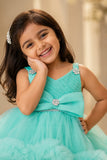 Green High-Low Party Wear Tulle Frock with Bow Detail For Girls