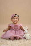 Onion Pink Party Frock with Pleated Flower Appliqué and Shimmer Finish For Girls