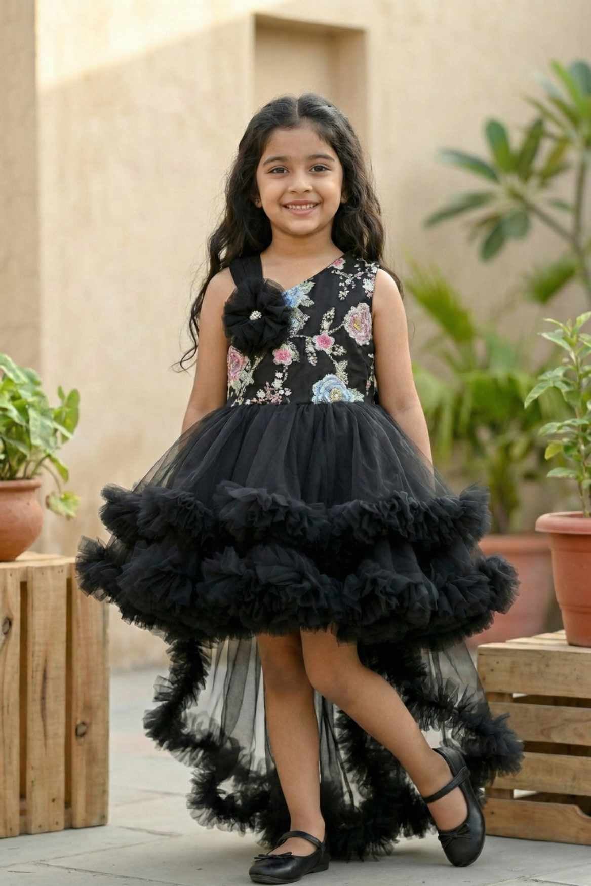 Black Party Frock with Floral Bodice and Ruffled Hemline And Tailback For Girls