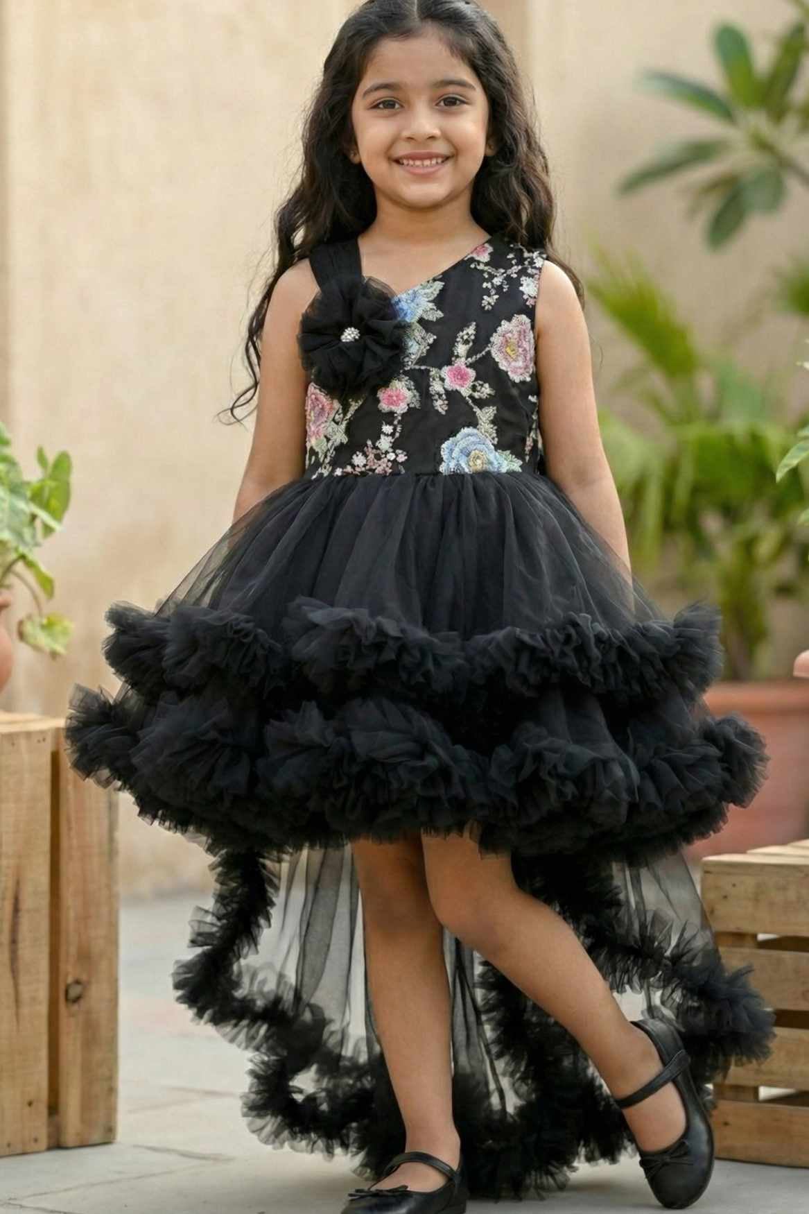Black Party Frock with Floral Bodice and Ruffled Hemline And Tailback For Girls
