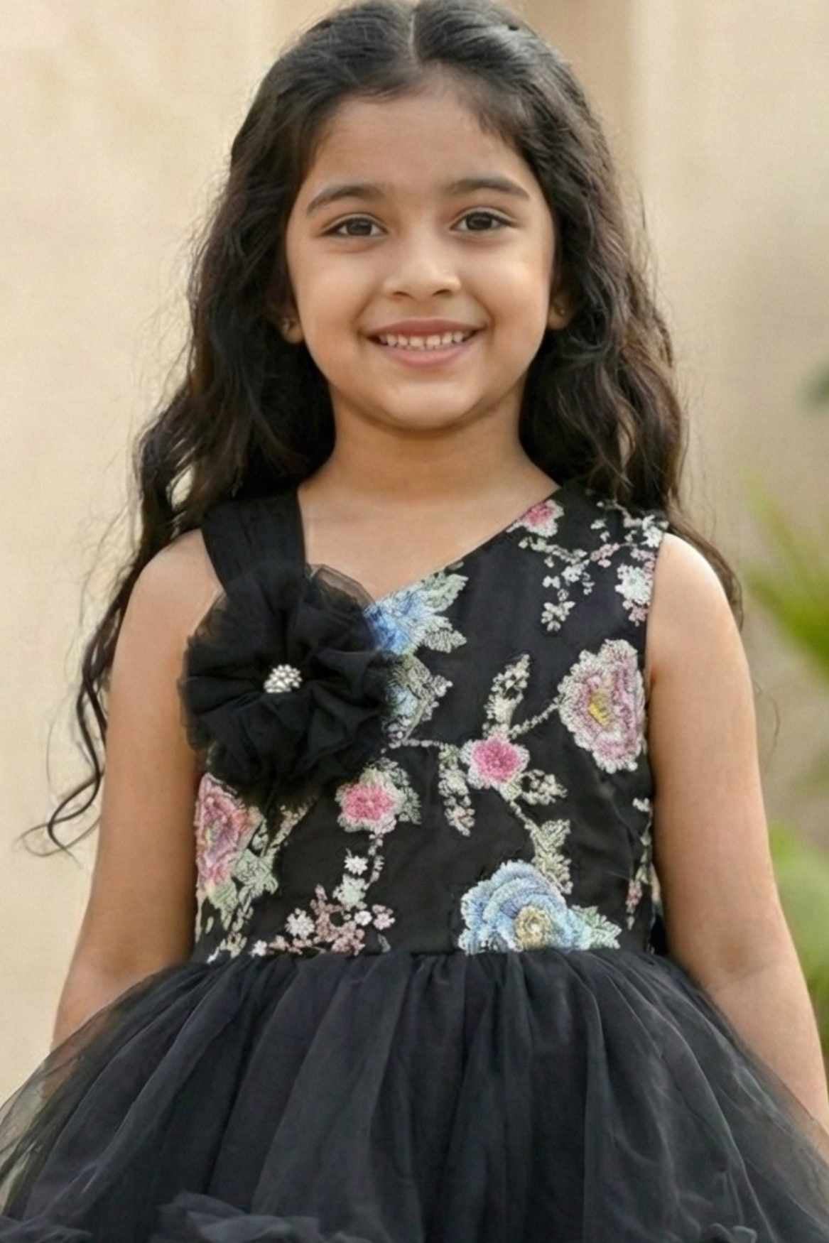 Black Party Frock with Floral Bodice and Ruffled Hemline And Tailback For Girls