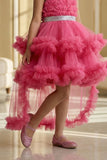 Girls Pink High-Low Party Frock with Ruffled Layers And Embellished Waistbelt