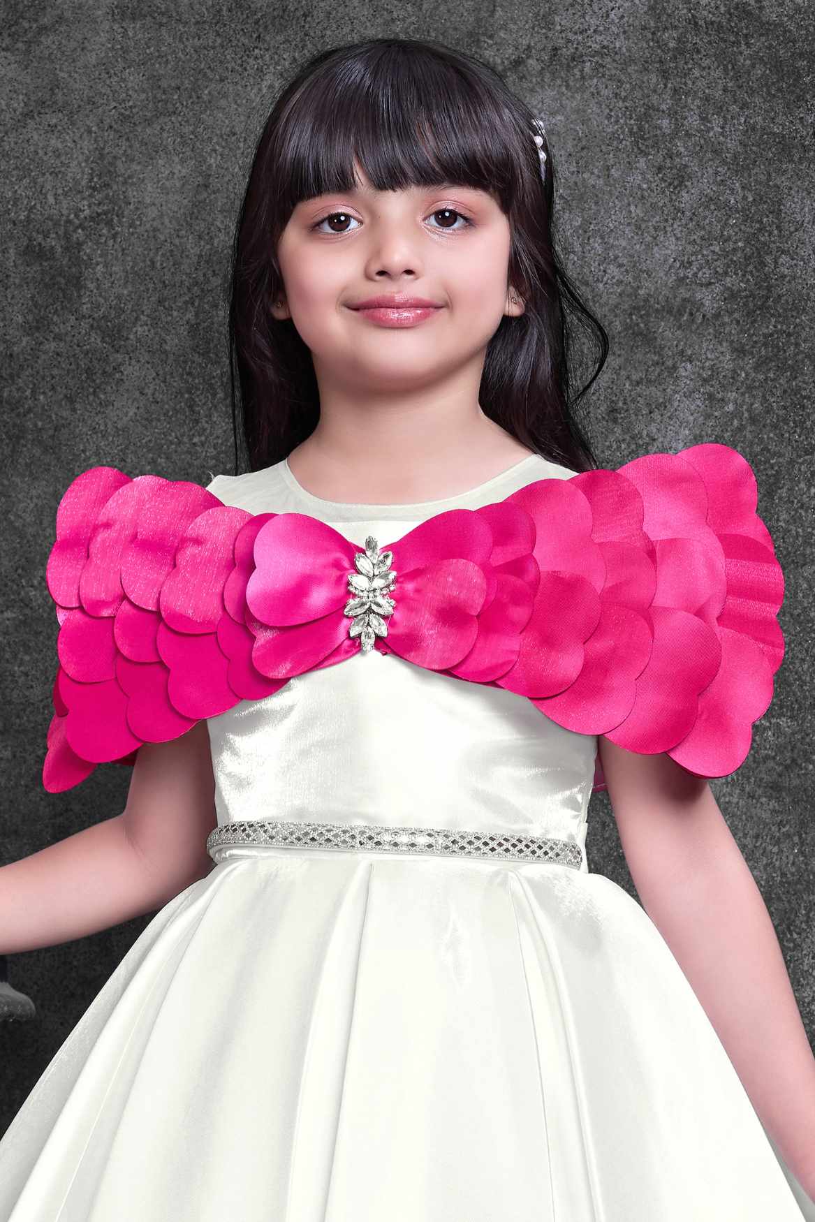 Off-White Party Wear Frock with Pink Bow Appliqué And Flared Skirt For Girls