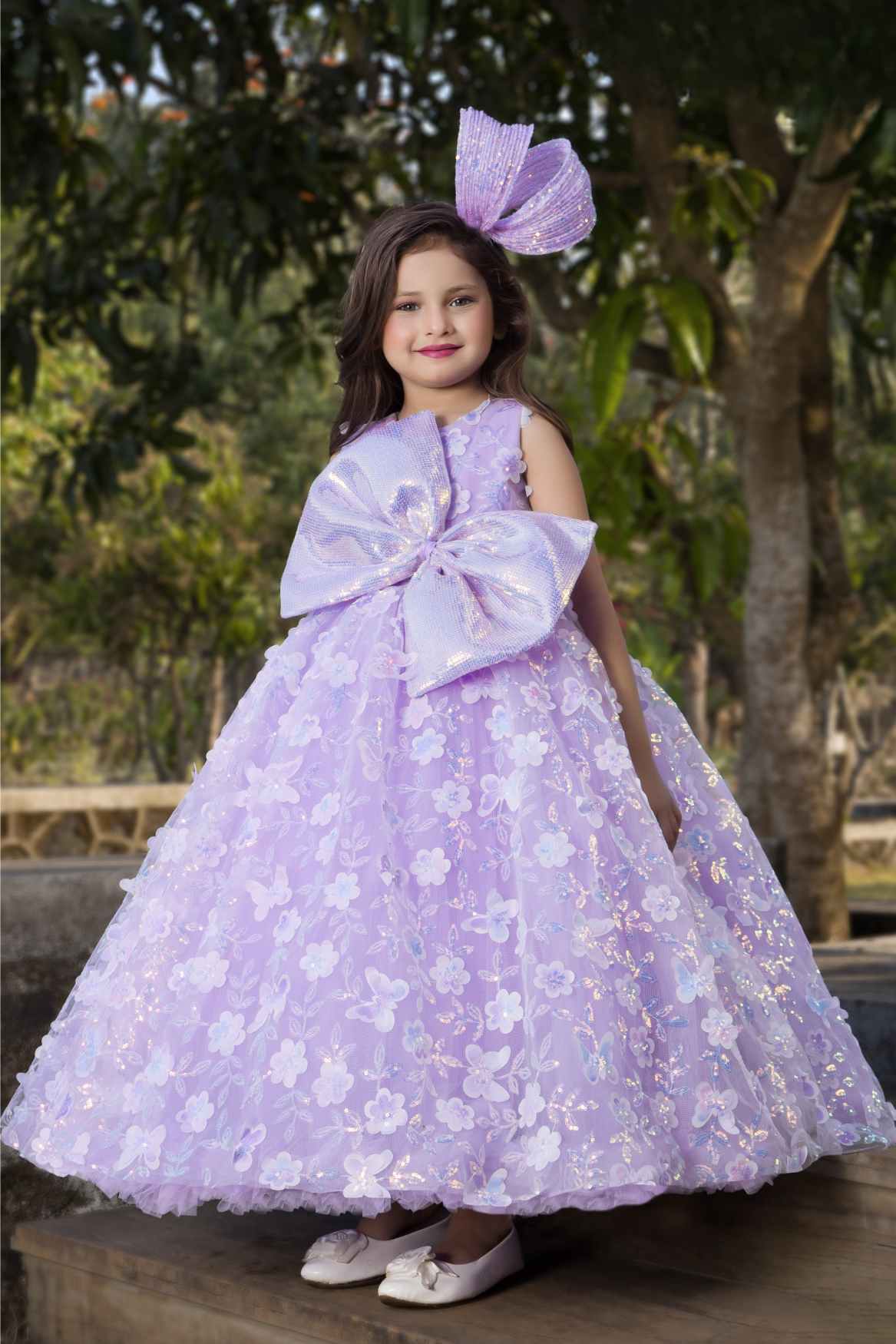 Lavender Party Wear Gown With Sequin Flowers And Giant Bow For Girls