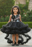 Black Party Frock with Floral Bodice and Ruffled Hemline And Tailback For Girls