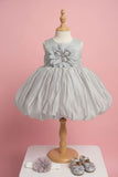 Grey Party Frock with Oversized Floral Appliqué and Pleated Shine Finish For Girls