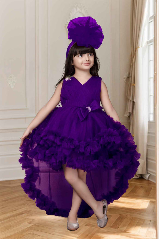 Purple Net Party Wear Tailback Frock Embellished With Bow For Girls