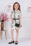 Cream Black Abstract Printed Dress With Belt And Bag For Girls