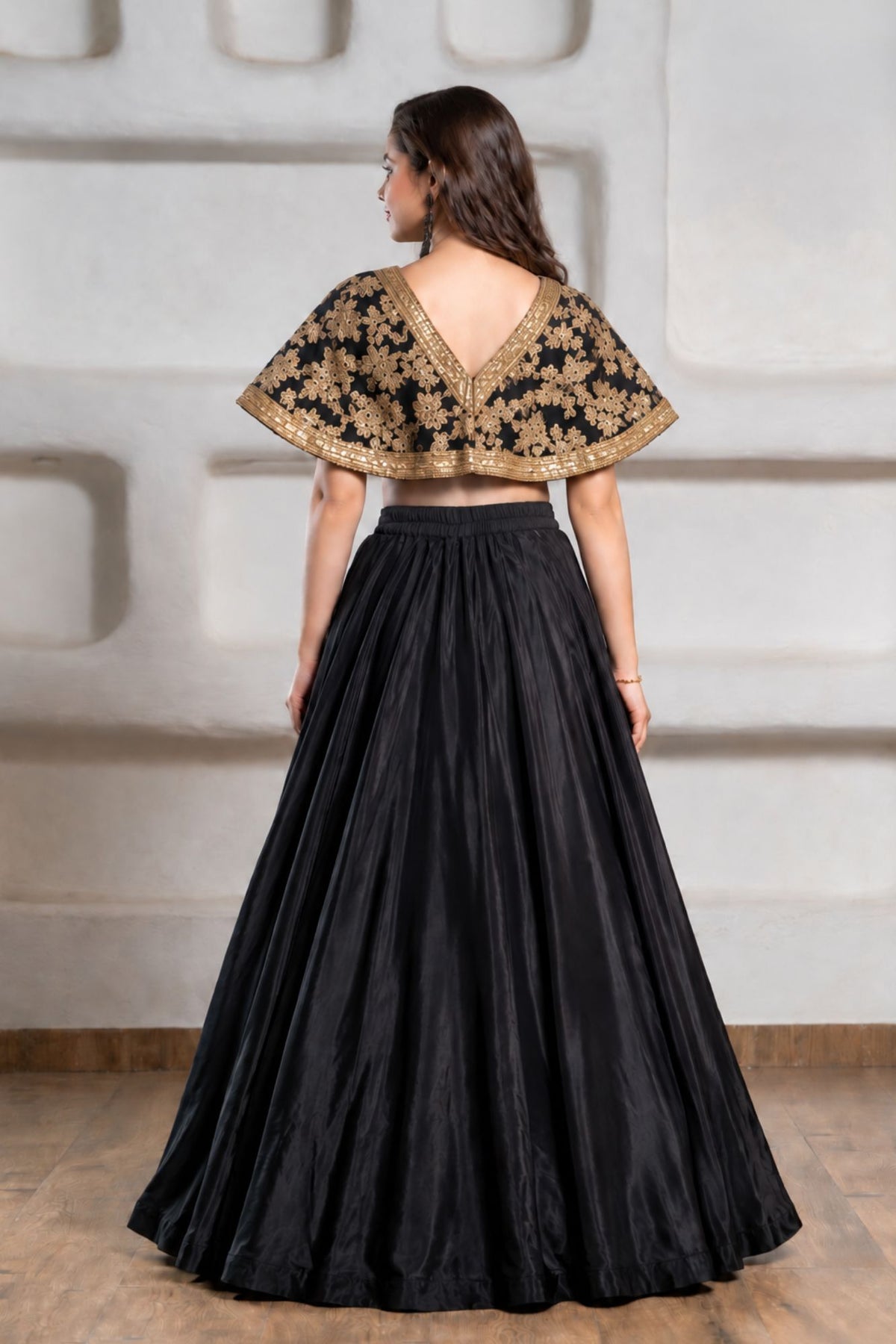 Girls Black And Gold Embroidered Cape Lehenga Choli