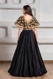 Girls Black And Gold Embroidered Cape Lehenga Choli