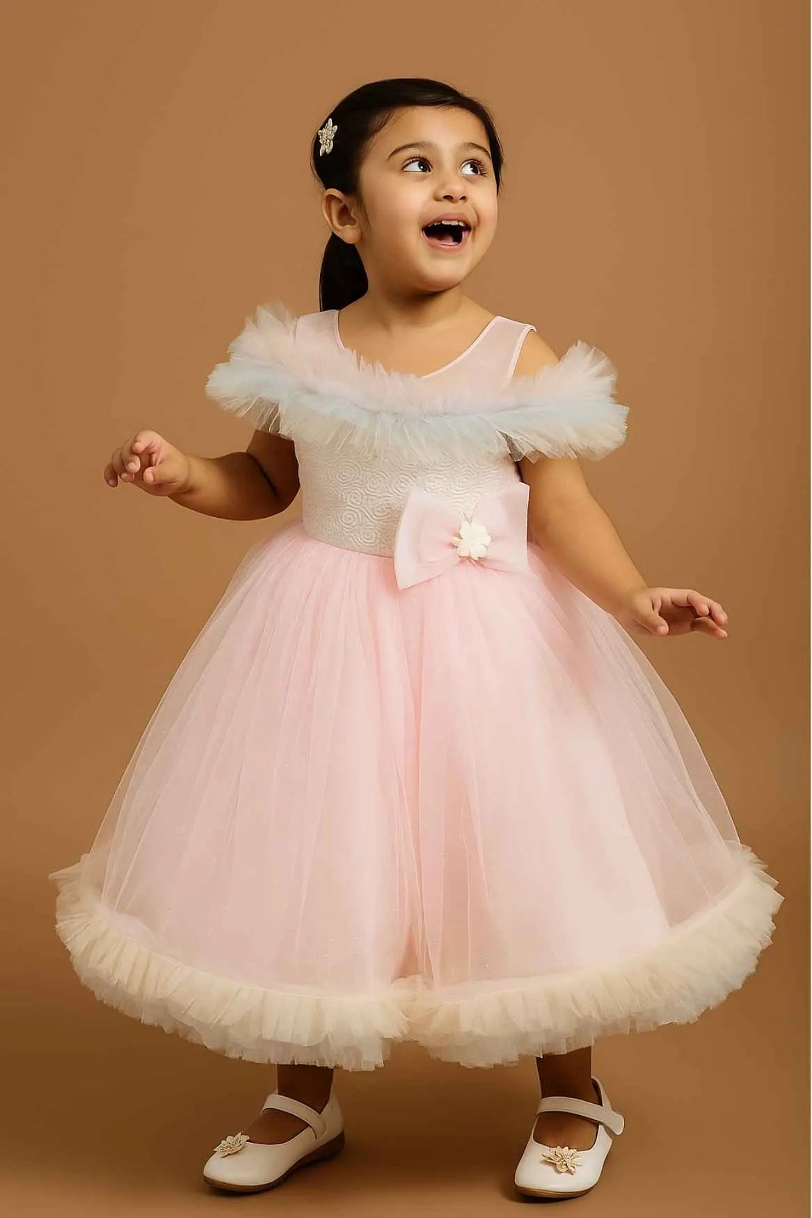 Pink Ruffle Net Gown With Bow Embellishment For Girls