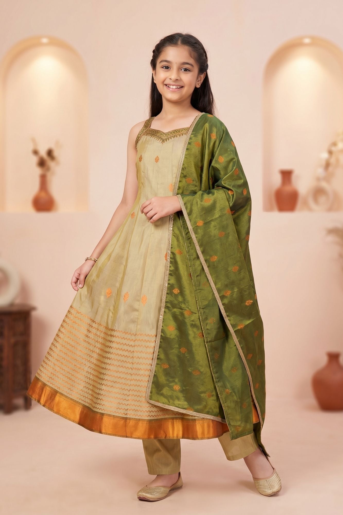 Girls Gold Silk Kurta Set with Zari Border And Green Dupatta