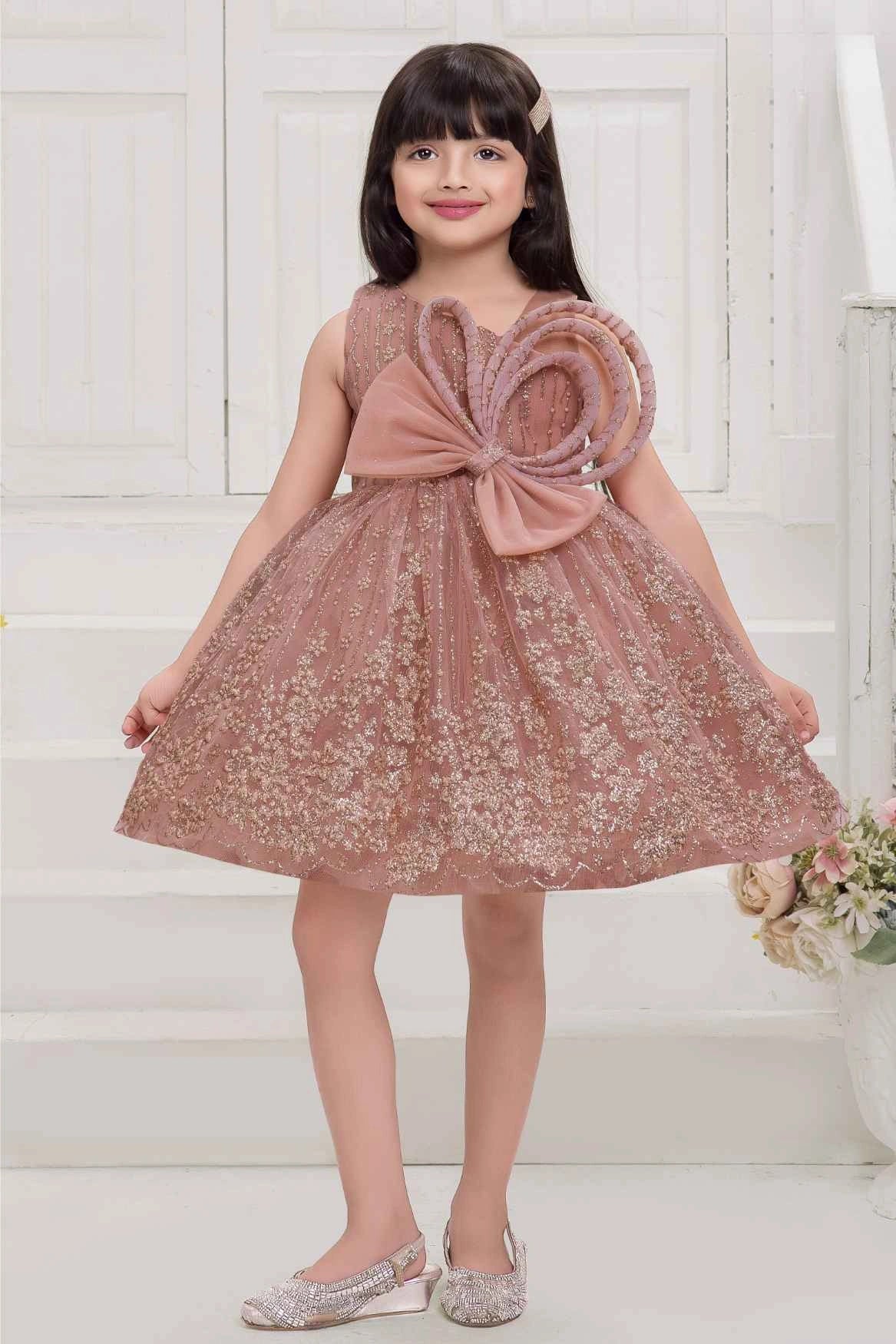 Peach Frock With Bow Embellished And Shimmer Printed For Girls