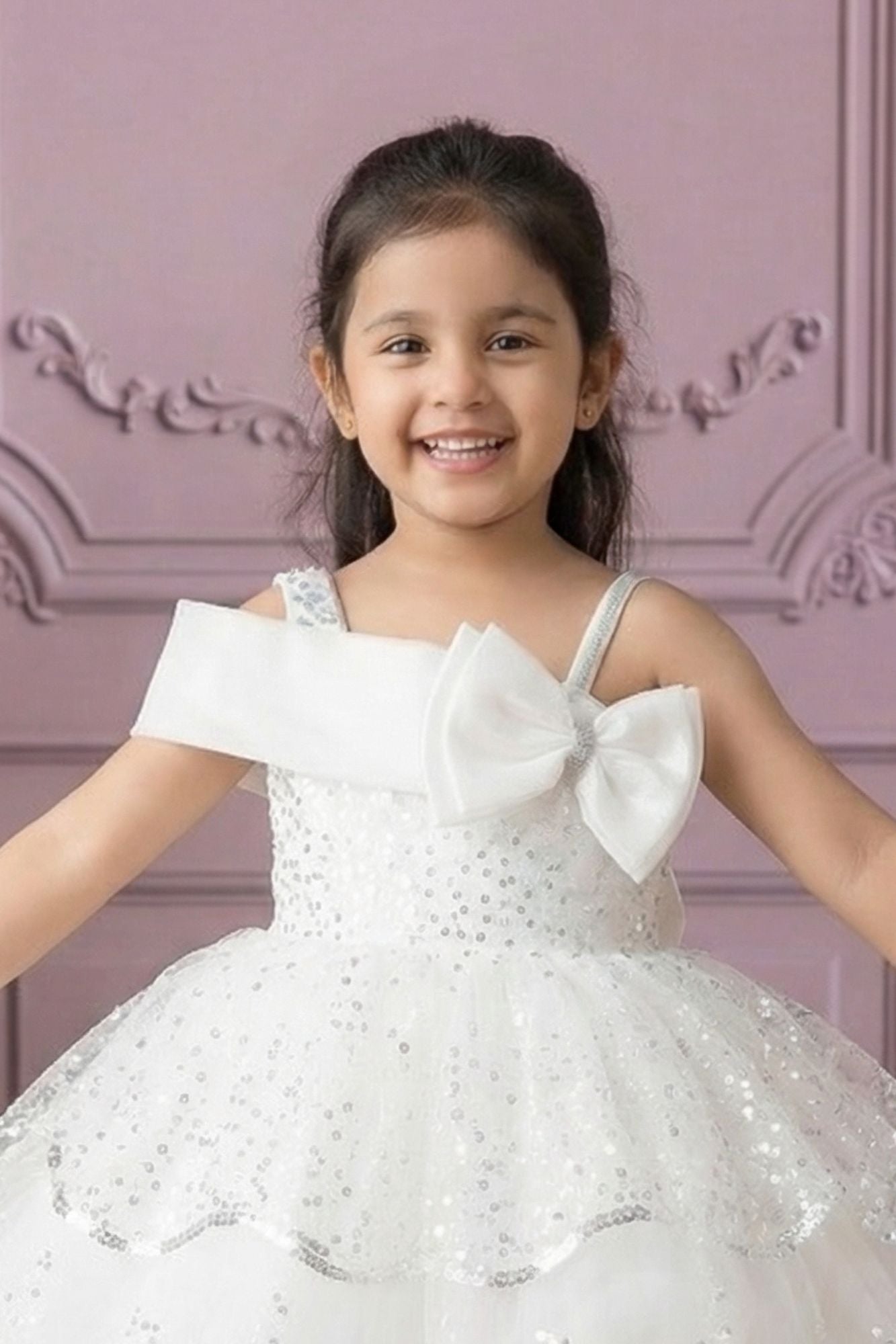 White Sequin Layered Ruffle Party Wear Frock With Statement Bow For Girls