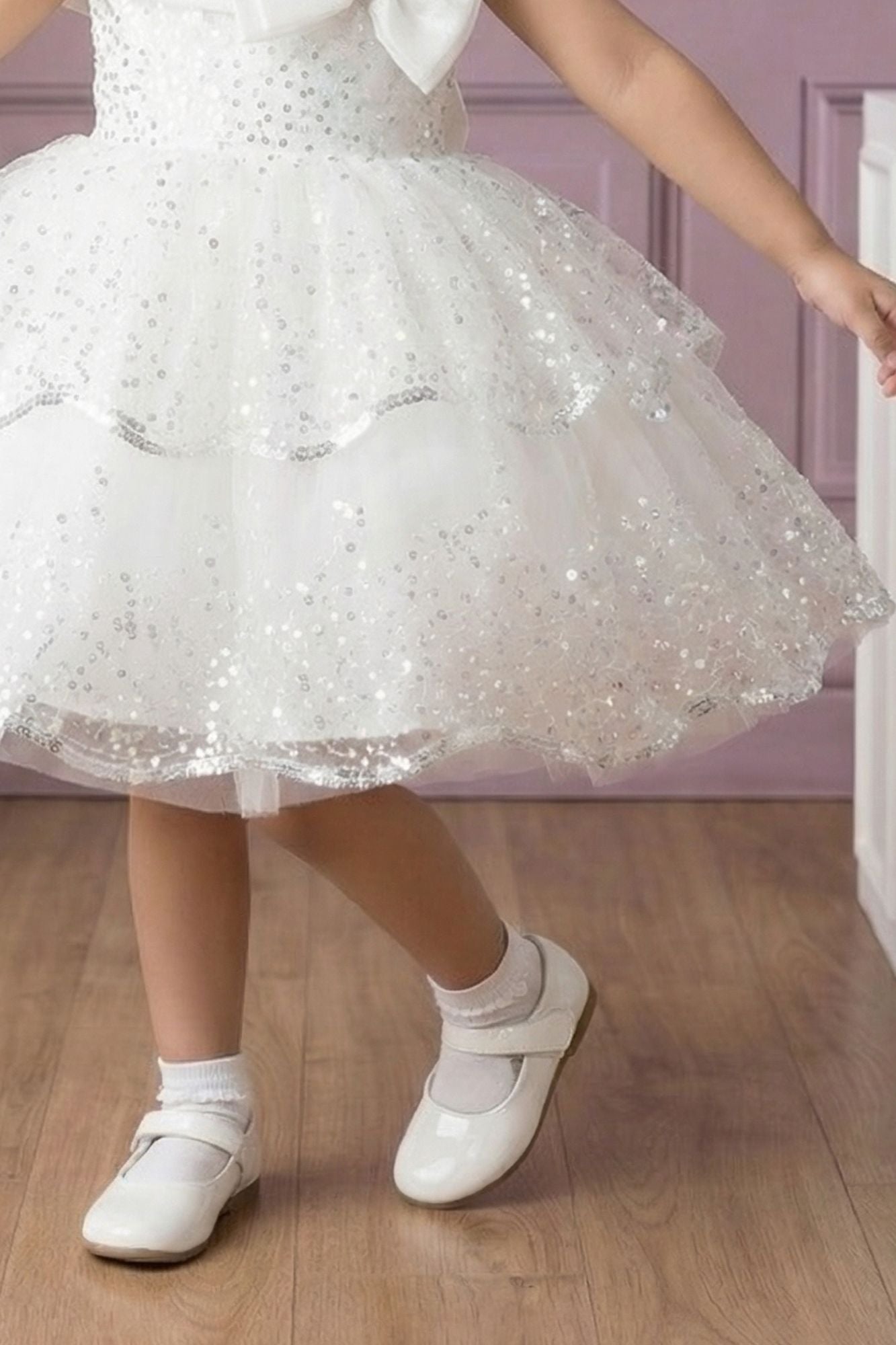 White Sequin Layered Ruffle Party Wear Frock With Statement Bow For Girls