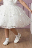 White Sequin Layered Ruffle Party Wear Frock With Statement Bow For Girls