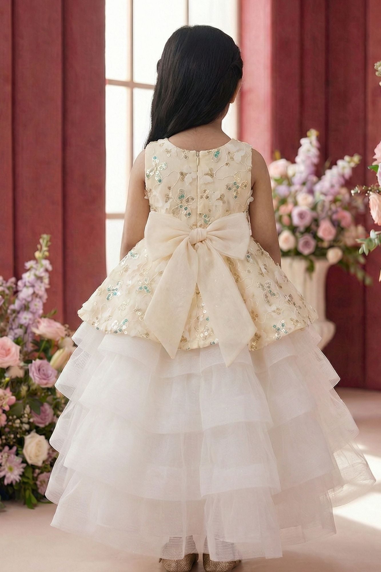 Girls Cream Layered Party Wear Gown with Floral Embroidery And Statement Bow