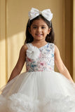 White Party Frock with Floral Bodice and Ruffled Hemline And Tailback For Girls