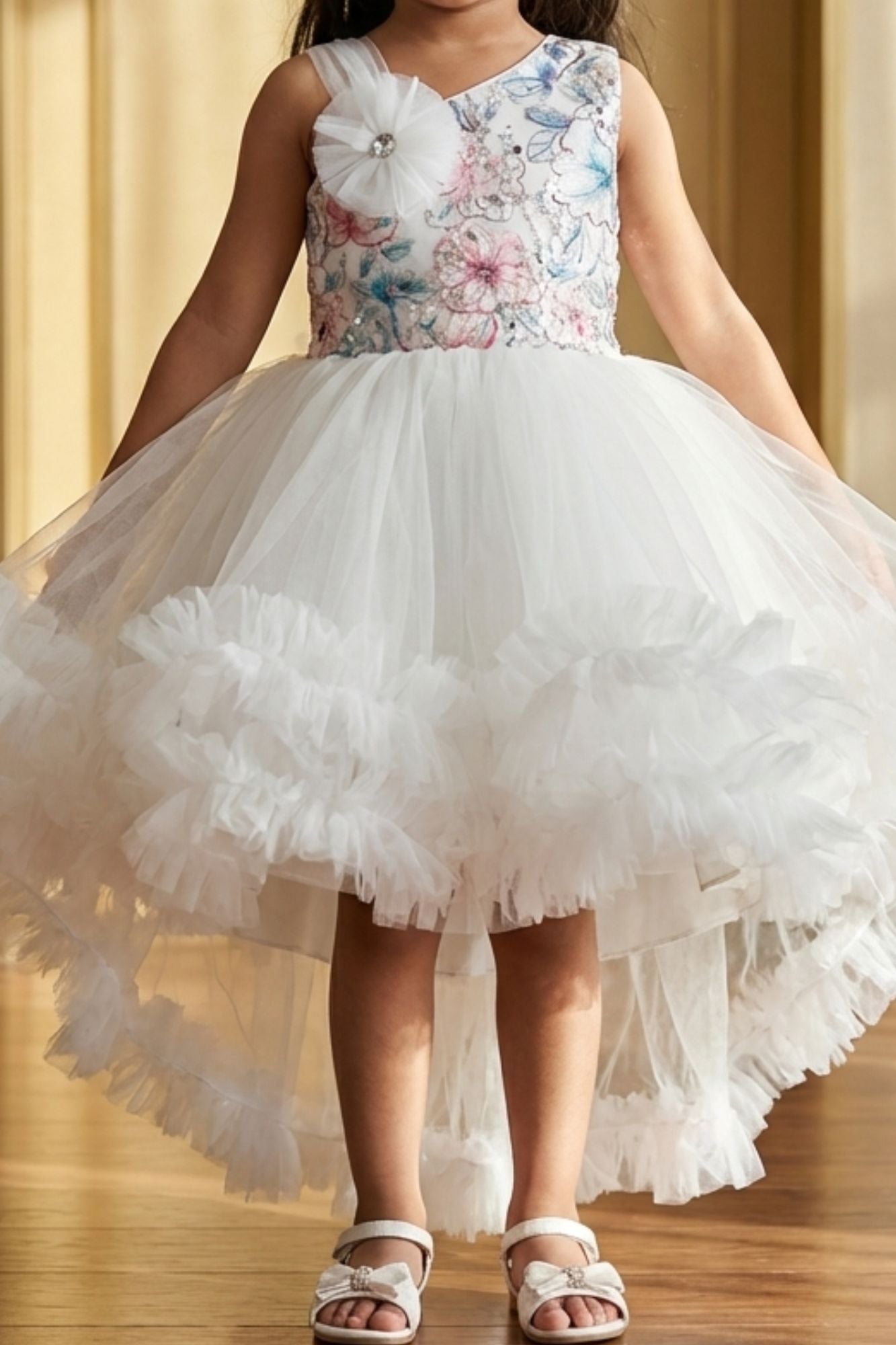 White Party Frock with Floral Bodice and Ruffled Hemline And Tailback For Girls