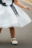 White Party Wear Frock with Oversized Black & Grey Floral Appliqué For Girls