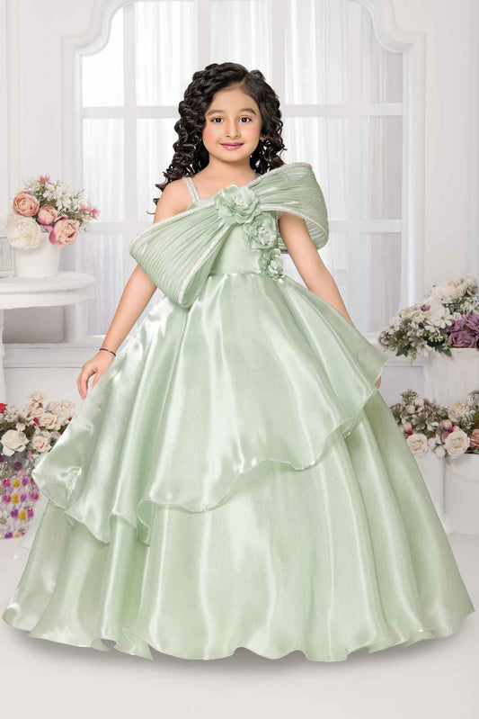 Pista Green Party Wear Gown With Floral And Bow Embellishment For Girls