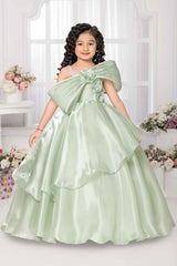 Pista Green Party Wear Gown With Floral And Bow Embellishment For Girls