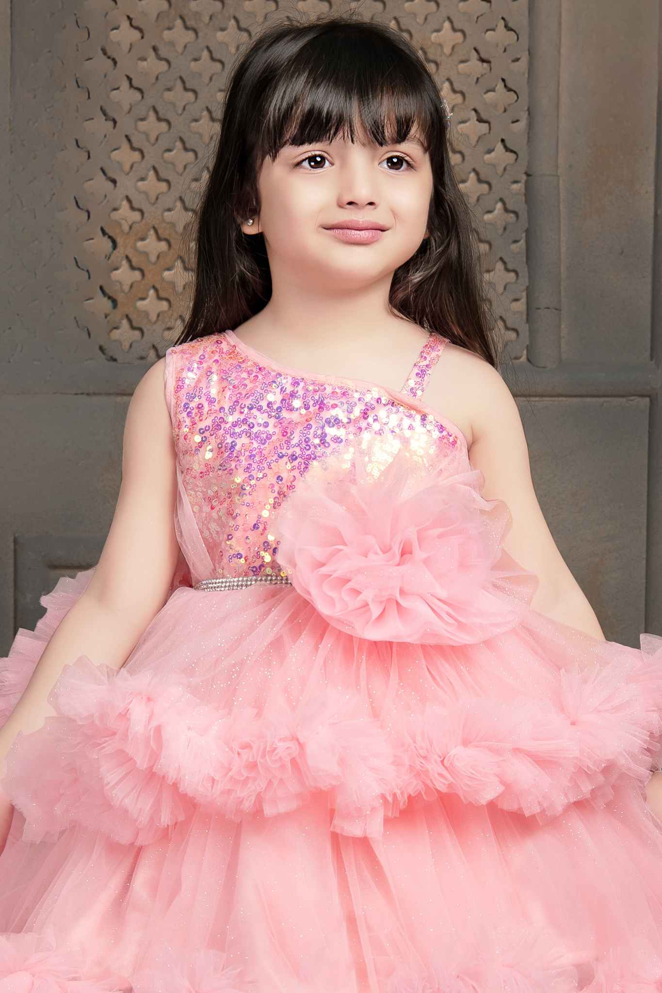 Peach Shimmer Tailback Party Wear Frock With Ruffle Layers For Girls