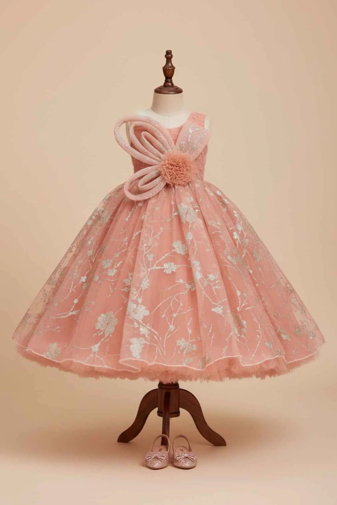 Peach Shimmer Party Gown with Oversized Bow & Floral Accent For Girls